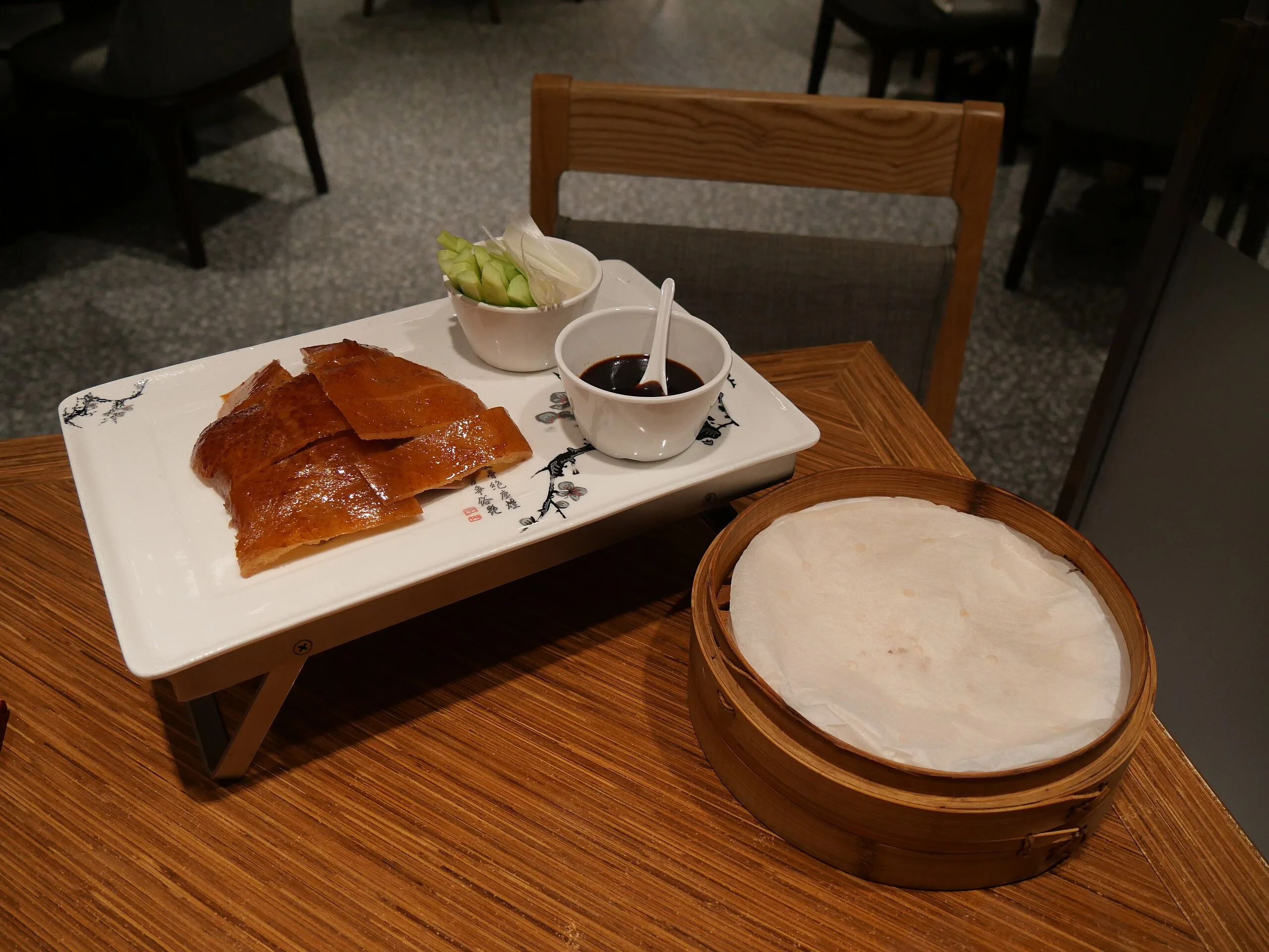 Peking duck served with traditional pancakes and accompaniments