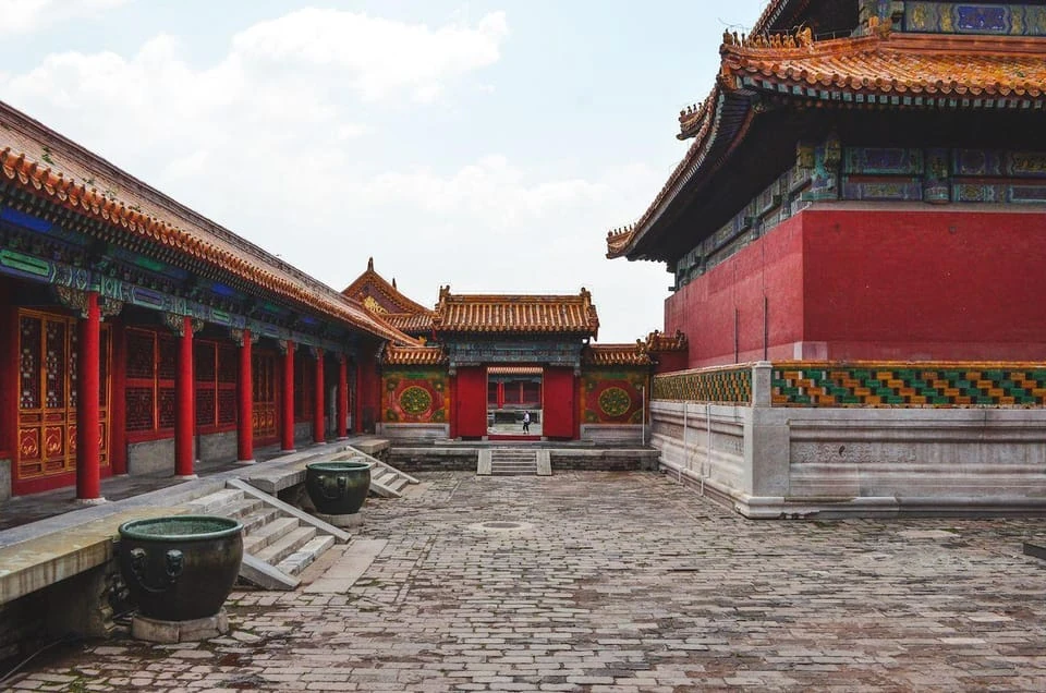 A palace courtyard with traditional red buildings in Beijing
